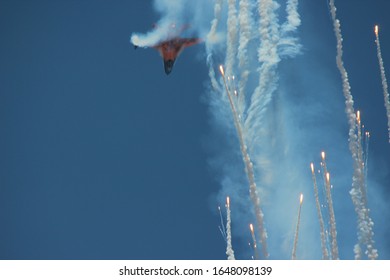 Military Aircraft Shooting Out Flares.