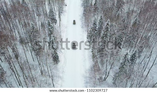 Military armored personnel carriers in the\
woods during military exercises. Clip. Top view of military armored\
personnel carriers in the forest in\
winter