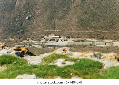 Military Base In Bakhchisarai. Secret Military Base A Top View. Military Unit In Crimea, Russia. Tanks, Armored Personnel Carriers,guns. War Zone. Mountainous Landscape. Military Unit In The Mountains