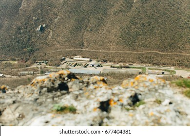 Military Base In Bakhchisarai. Secret Military Base A Top View. Military Unit In Crimea, Russia. Tanks, Armored Personnel Carriers,guns. War Zone. Mountainous Landscape. Military Unit In The Mountains