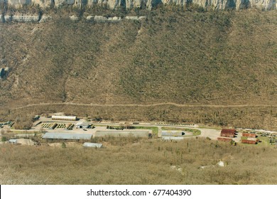 Military Base In Bakhchisarai. Secret Military Base A Top View. Military Unit In Crimea, Russia. Tanks, Armored Personnel Carriers,guns. War Zone. Mountainous Landscape. Military Unit In The Mountains