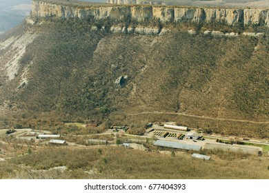 Military Base In Bakhchisarai. Secret Military Base A Top View. Military Unit In Crimea, Russia. Tanks, Armored Personnel Carriers,guns. War Zone. Mountainous Landscape. Military Unit In The Mountains