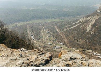 Military Base In Bakhchisarai. Secret Military Base A Top View. Military Unit In Crimea, Russia. Tanks, Armored Personnel Carriers,guns. War Zone. Mountainous Landscape. Military Unit In The Mountains