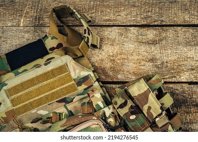 Military Body Armor On Wooden Background Close Up