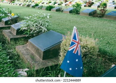 Military British World War Two Grave With No Inscription Unknown Soldier With Peaceful And Tranquil Down In Cemetery Graveyard. Shot Of Gravestone In Churchyard.