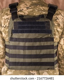 Military Bulletproof Vest Wear By A Military Man, View From The Back Side
