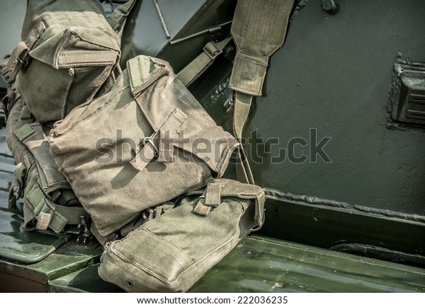 Military
canvas kit bags hanging over an armoured
car.
