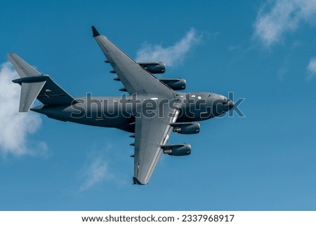 Military cargo transport airplane flying