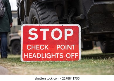 Military Checkpoint With Tank Armoured Personnel Vehicle On Boarder. Stop Check Point Red Sign Army Equipment.