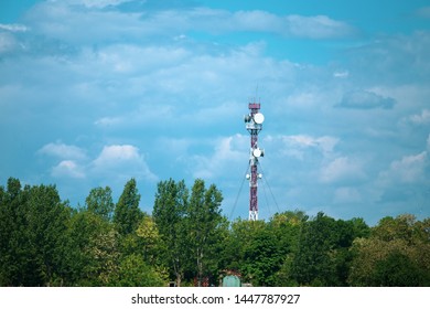 Military Communications Tower With Various Communication Equipments And Antennas For Radio And 5G Inside A Forest