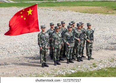 Military Competition ARMY2018, A Platoon Of Chinese Soldiers With The Flag Of The Chinese People`s Republicn Kostroma Region The Town Of Pesochnoye June 2018