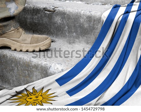 Military concept on the background of the flag of Uruguay