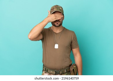 Military With Dog Tag Over Isolated On Blue Background Covering Eyes By Hands. Do Not Want To See Something