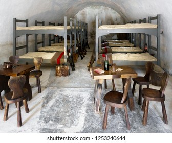 Military Dorm Room With Bunkbeds; Rifle And Table Setting