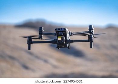 Military drone in flight observing positions - Shutterstock ID 2274954531