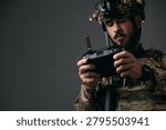 Military drone operator using remote controller in dark studio, close up of tactical soldier hands, UAV piloting, reconnaissance technology and modern defense communication concept