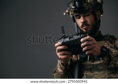 Military drone operator using remote controller in dark studio, close up of tactical soldier hands, UAV piloting, reconnaissance technology and modern defense communication concept