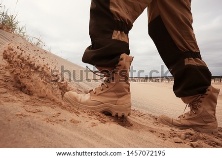 military exercises in the desert / legs in army boots, soldiers of the desert