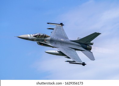 Military F16 fighter jet close up flying through the air. Royal Netherlands Air Force F16 fighter jet aircraft taking off. Jet F-16 fly in the sky.