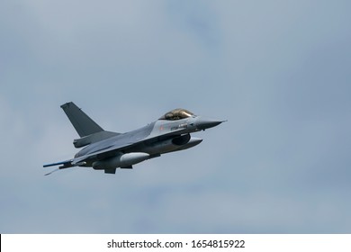 Military F16 Fighter Jet Close Up Flying Through The Air. Royal Netherlands Air Force F16 Fighter Jet Aircraft Taking Off. Jet F-16 Fly In The Sky.