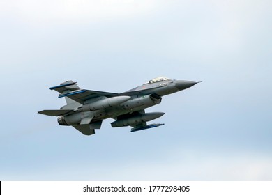 Military F16 fighter jet close up flying through the air. Royal Netherlands Air Force F16 fighter jet aircraft taking off. Jet F-16 fly in the sky.