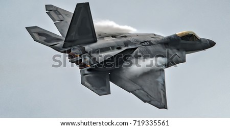 Military F22 fighter jet flying 