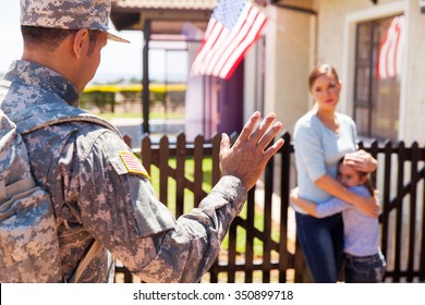 Military Father Waving Goodbye To His Sad Family