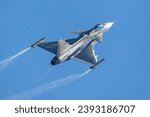 Military fighter jet plane at air base. Airport and airfield. Air force flight operation. Aviation and aircraft. Air defense. Military industry. Fly and flying. Dogfight and afterburner.