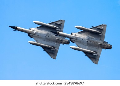 Military fighter jet plane at air base. Airport and airfield. Air force flight operation. Aviation and aircraft. Air defense. Military industry. Fly and flying. Dogfight and afterburner. - Powered by Shutterstock
