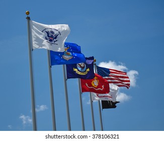 Military Flags Flying Proudly In A Clear Blue Sky