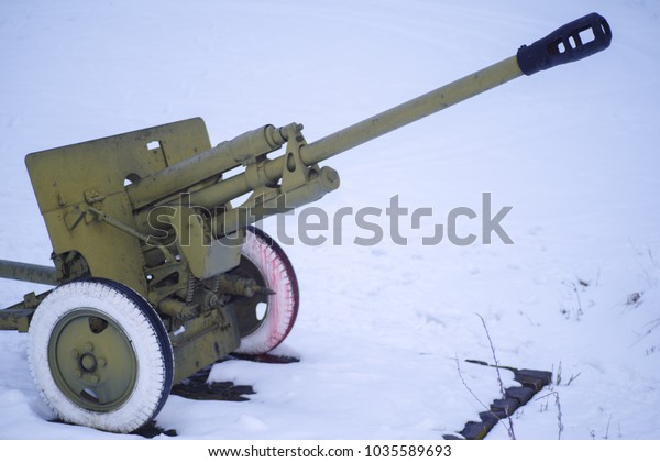 The military gun on\
the street in snow