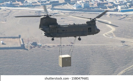 Military Helicopter In Afghanistan With An External Load