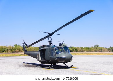 Military Helicopter (huey) At A Base