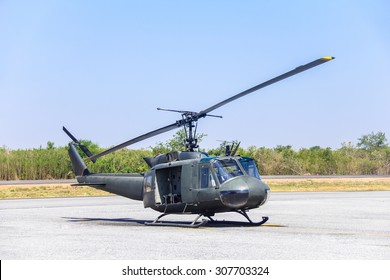 Military Helicopter (huey) At A Base