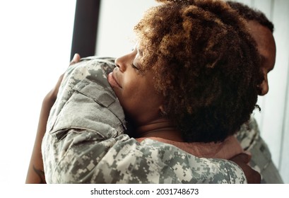 Military Husband Hugging His Wife
