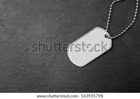 Military ID tag on dark background