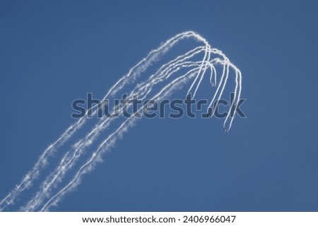 Military jet fighters flying in formation during airshow