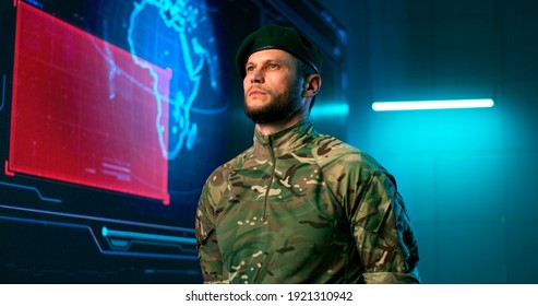 Military Man In Camouflage Standing Against Big Screen With Count Down In Modern Command Center During World War