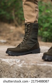 Military Man In Dark Green Leather Tactical Boots