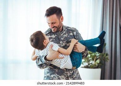 Military Man Father Hugs Son. Portrait Of Happy American Family. Happy American Family, Father With Son. Happy Male Soldier Dad Reunited With Son After US Army