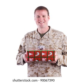 Military Man Holding A Christmas Present