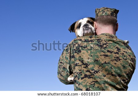 Military Man Hugs Dog
