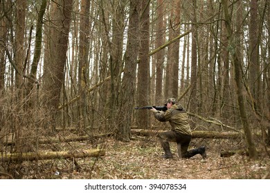 military man with Kalashnikov rifle outdoor forest - Shutterstock ID 394078534