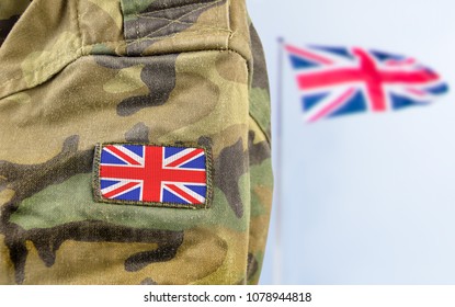 Military Man Posing In Front Of UK Flag