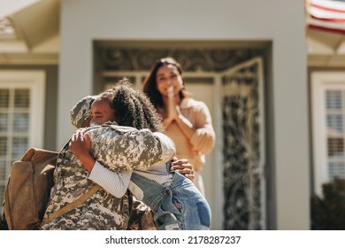 Military man saying goodbye to his family before leaving for war. American serviceman embracing his daughter. Patriotic soldier leaving his family to go serve his country in the army. - Shutterstock ID 2178287237