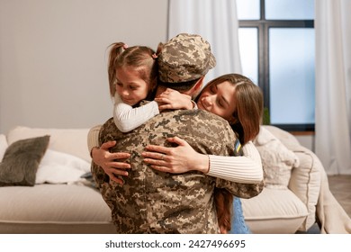 military man of the Ukrainian army in camouflage uniform returned home and hugs his family, soldier goes to war and says goodbye to his daughter and wife, the concept of mobilization in Ukraine - Powered by Shutterstock