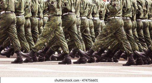 Military Men In Green Dress Uniform Marching To Victory Parade