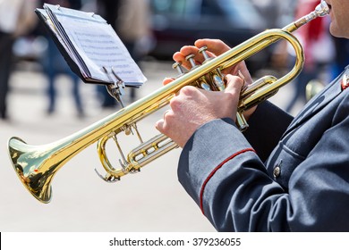 Military Musician Playing On Gold Trumpet In Army Brass Band