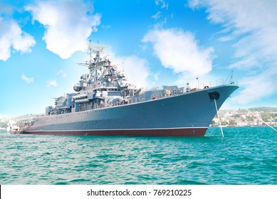 Military Navy Ship In The Bay With Blue Sky And Clouds