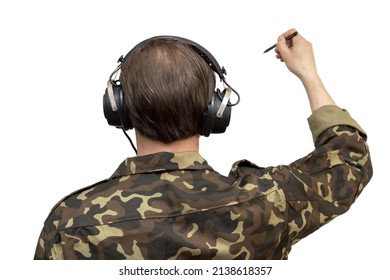 A Military Officer With Headphones Draws With A Pencil On A White Background, Selective Focus, Isolate. Concept: Military Cartographer, Secret Spy, Special Operation Map.